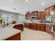 Modern kitchen featuring stainless steel appliances and ample cabinet space at 3213 Kentshire Blvd, Ocoee, FL 34761