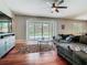 Comfortable living room with sliding glass doors to the outdoor pool area at 3213 Kentshire Blvd, Ocoee, FL 34761