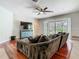 Inviting living room featuring hardwood floors, a ceiling fan, and sliding glass doors at 3213 Kentshire Blvd, Ocoee, FL 34761