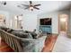 Spacious living room showcasing hardwood floors and a media center at 3213 Kentshire Blvd, Ocoee, FL 34761