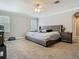Spacious main bedroom with large bed, ceiling fan, and neutral tones at 3213 Kentshire Blvd, Ocoee, FL 34761