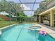 Relaxing screened-in pool and spa area with covered patio for outdoor entertaining at 3213 Kentshire Blvd, Ocoee, FL 34761
