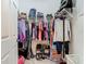Walk-in closet with wire shelving and an array of clothing and shoes at 3213 Kentshire Blvd, Ocoee, FL 34761