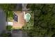 An aerial shot of the home with a private backyard pool and solar panels at 322 Shadow Oak Dr, Casselberry, FL 32707