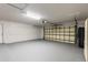 An oversized two car garage with painted walls and floors and a garage door at 322 Shadow Oak Dr, Casselberry, FL 32707