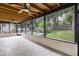 Screened porch featuring open ceiling, ceiling fans, and a view of the pool and fenced backyard at 322 Shadow Oak Dr, Casselberry, FL 32707
