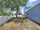 Large backyard with a privacy fence and mature trees, offering plenty of space for outdoor activities at 3259 Alling Ct, Deltona, FL 32725