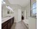 Bathroom featuring double sinks, ample counter space and vanity cabinets at 3259 Alling Ct, Deltona, FL 32725
