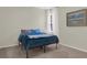 Bright bedroom featuring a bed with blue bedding and light walls, creating a cozy atmosphere at 3259 Alling Ct, Deltona, FL 32725