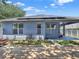 Exterior of the home highlighting a wooden deck and solar panels on the roof, showcasing modern features at 3259 Alling Ct, Deltona, FL 32725