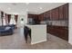 Open concept with island bar top, cherry cabinets, and stainless appliances at 3259 Alling Ct, Deltona, FL 32725