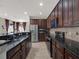 Sleek kitchen with granite countertops, stainless steel appliances, and tiled backsplash at 3259 Alling Ct, Deltona, FL 32725