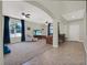 A spacious living room featuring neutral walls, large windows and tile floors at 3259 Alling Ct, Deltona, FL 32725