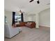 A spacious living room featuring neutral walls, carpet and a large sectional sofa at 3259 Alling Ct, Deltona, FL 32725