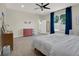 Relaxing main bedroom features carpet, ceiling fan, and view to exterior at 3259 Alling Ct, Deltona, FL 32725