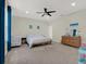 Bright, large bedroom with plush carpet, ceiling fan, and ample closet space at 3259 Alling Ct, Deltona, FL 32725