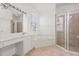 Well-lit bathroom features a soaking tub, glass-enclosed shower, and vanity, offering a luxurious and functional space at 356 Via Tuscany Loop, Lake Mary, FL 32746