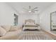 Cozy bedroom with patio access features natural light and inviting furniture, perfect for relaxation and outdoor enjoyment at 356 Via Tuscany Loop, Lake Mary, FL 32746