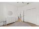 Well lit Bedroom with changing table and view into hall featuring light colored wood floor and large closet at 356 Via Tuscany Loop, Lake Mary, FL 32746