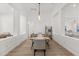 Open dining room with wood floors, pendant lighting, and views of living areas, perfect for entertaining at 356 Via Tuscany Loop, Lake Mary, FL 32746