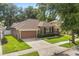 Charming single-story home with a well-manicured lawn and an attached two-car garage at 356 Via Tuscany Loop, Lake Mary, FL 32746