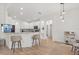 Bright kitchen with white cabinets, granite countertops, bar seating and stainless steel appliances at 356 Via Tuscany Loop, Lake Mary, FL 32746