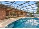 A private backyard oasis features a refreshing pool, cozy seating area, and outdoor dining, perfect for relaxation and entertaining at 356 Via Tuscany Loop, Lake Mary, FL 32746