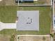 Aerial view of the property showcasing the roof, driveway, and surrounding greenery at 3944 Sw 130Th Loop, Ocala, FL 34473