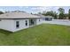 Spacious backyard with white fence, patio, and lush green lawn at 3944 Sw 130Th Loop, Ocala, FL 34473