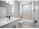 Bathroom with vanity, undermount sink and tiled tub with window at 3944 Sw 130Th Loop, Ocala, FL 34473