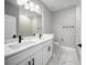 Bathroom with double sink vanity and tiled shower at 3944 Sw 130Th Loop, Ocala, FL 34473