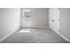 Neutral bedroom with carpet, window and closet at 3944 Sw 130Th Loop, Ocala, FL 34473
