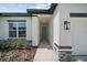 Inviting front entrance with modern architectural details and manicured landscaping at 3944 Sw 130Th Loop, Ocala, FL 34473