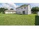 Large, well-kept back yard featuring a sliding glass door and plenty of room for outdoor activities at 4208 Lugano Ct, Kissimmee, FL 34746