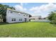 Spacious, well-maintained back yard enclosed by a white fence, perfect for entertaining and relaxation at 4208 Lugano Ct, Kissimmee, FL 34746