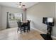 Well-lit dining area featuring tiled floors and a ceiling fan at 4208 Lugano Ct, Kissimmee, FL 34746