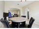 Comfortable dining area with a marble-top table and leather chairs at 4208 Lugano Ct, Kissimmee, FL 34746