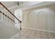 Spacious foyer featuring arched wall decor and tile flooring, leading to the living spaces at 4208 Lugano Ct, Kissimmee, FL 34746