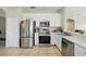 Well-equipped kitchen featuring stainless steel appliances, ample cabinetry, and modern finishes at 4208 Lugano Ct, Kissimmee, FL 34746