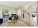 Bright living room featuring tiled floors and a view of the staircase at 4208 Lugano Ct, Kissimmee, FL 34746