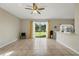 Open-concept living room with tile flooring, ample natural light, and a view of the backyard at 4208 Lugano Ct, Kissimmee, FL 34746
