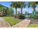 Well-maintained community tennis court with a secure fence and neatly manicured landscaping at 4208 Lugano Ct, Kissimmee, FL 34746