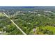 Vast aerial shot shows lush trees and nearby lake developments in the distance at 4825 N Fort Christmas Rd, Christmas, FL 32709