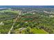 An outlined aerial view highlights the boundary of a parcel of land in a densely wooded area at 4825 N Fort Christmas Rd, Christmas, FL 32709