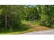 Gated property entrance surrounded by mature trees and vegetation at 4825 N Fort Christmas Rd, Christmas, FL 32709