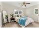 Cozy bedroom with a comfortable bed, decorative pillows, and soft natural lighting at 5115 W Livingston St, Orlando, FL 32811