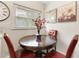 Cozy kitchen nook featuring a dark wood table, leather chairs and decorative accents at 5115 W Livingston St, Orlando, FL 32811