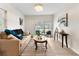 Bright and airy living room with neutral colors, modern decor and new flooring at 5115 W Livingston St, Orlando, FL 32811