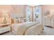 Charming pink bedroom with decorative butterflies, plush bedding, and abundant natural light at 5684 Gingham Dr, Kissimmee, FL 34758
