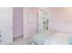Light pink bedroom featuring open closet and view of the upstairs landing at 5684 Gingham Dr, Kissimmee, FL 34758